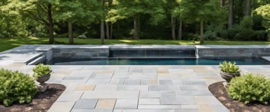 Chatham Blue Granite Pavers from Cape Cod Hardscapes, featuring a uniform blue-gray hue and a durable, textured surface, ideal for enhancing outdoor spaces with a natural stone aesthetic.