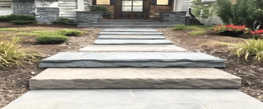 Tumbled Bluestone Steps with a rustic, weathered appearance and natural blue-gray hues, ideal for adding character and durability to outdoor staircases.